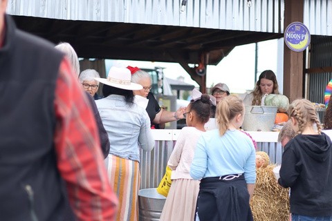 Volunteers serving families at Harvest Weekend